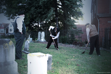 Two men with shovels