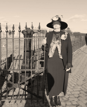 Woman at cemetery gate