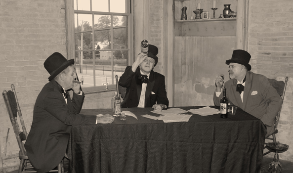 Three men sitting at a table