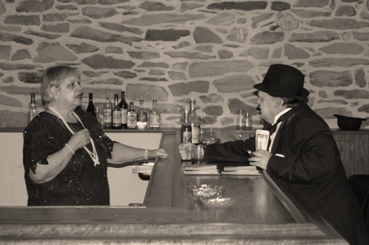 Woman behind a bar arguing with man