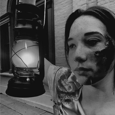 Woman holding lantern
