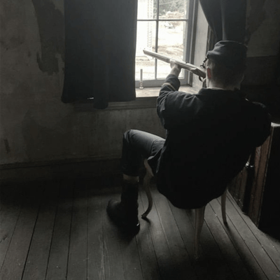 Man looking through spyglass