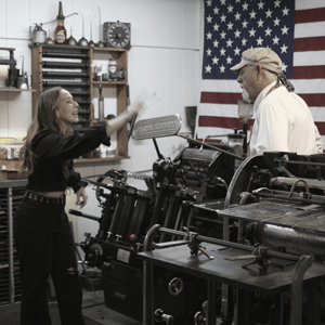 Man and woman at printing press