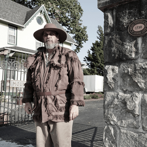 Man at cemetery gate