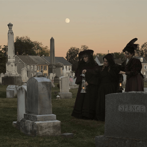 Three women in cemetery