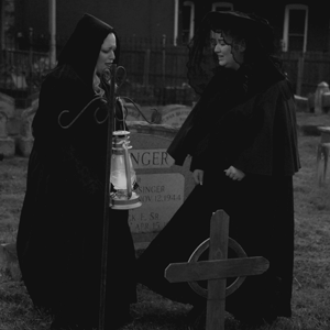 Two women in cemetery