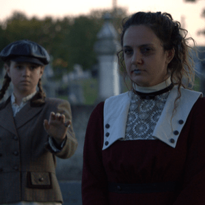 Two women in cemetery