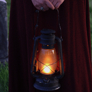 Woman holds lantern